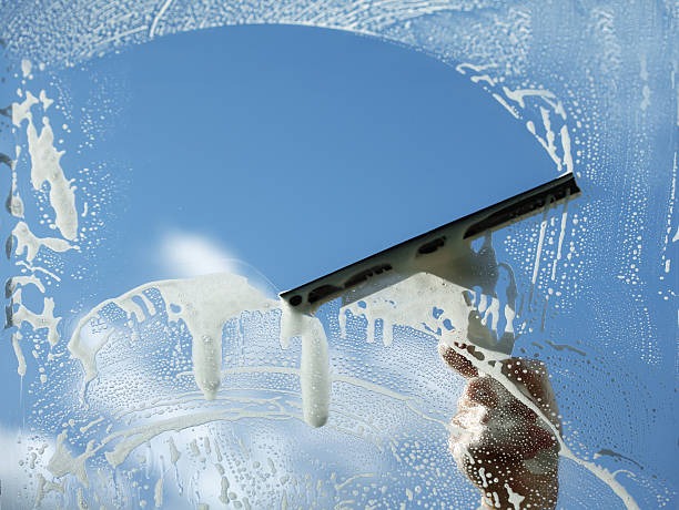 cleaning window through squeege